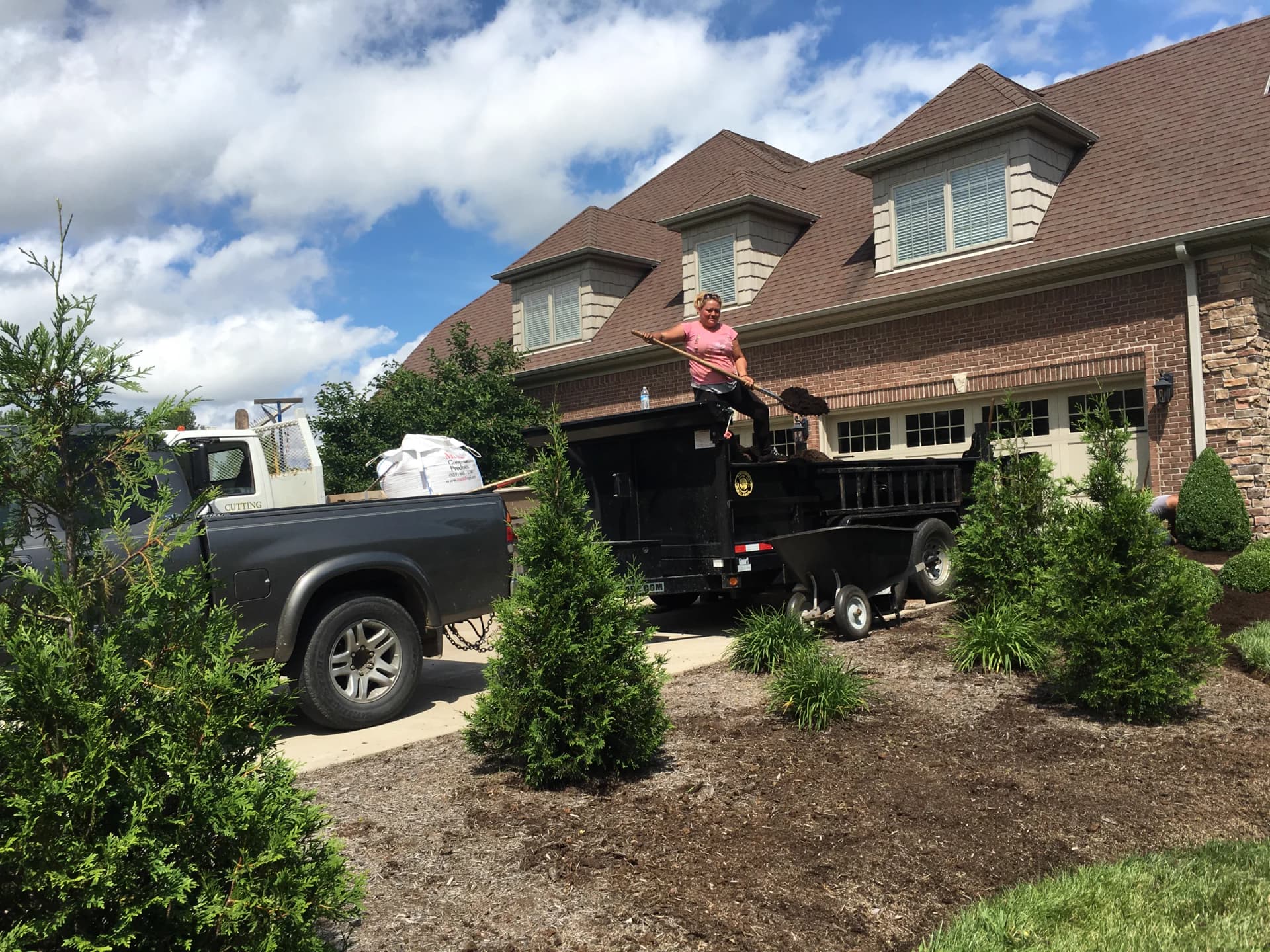 Landscape crew beginning property walkthrough before renovation scope is set